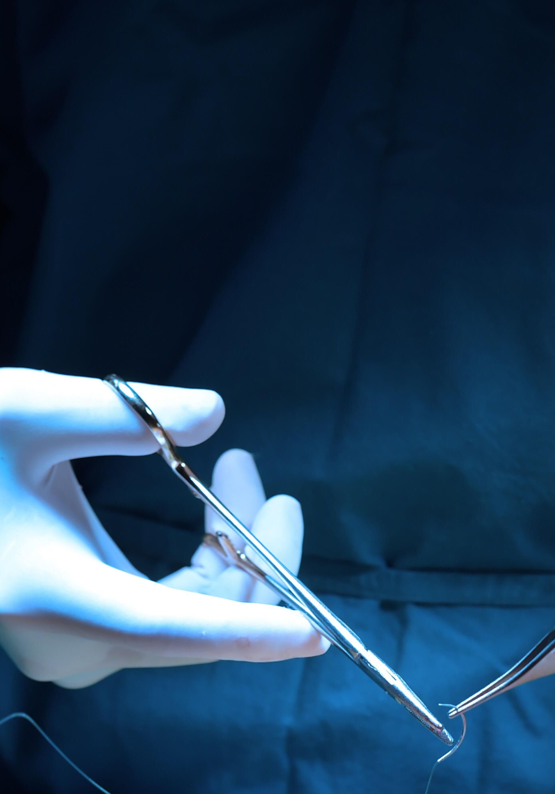 surgeon hands with surgical tools